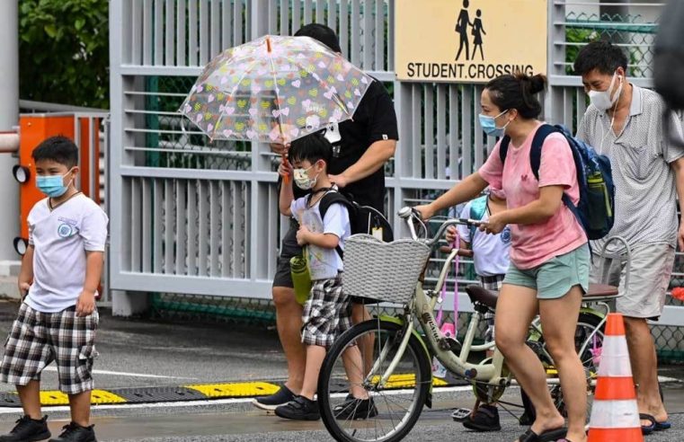 Singapore warns new virus strains infecting more children, shuts schools