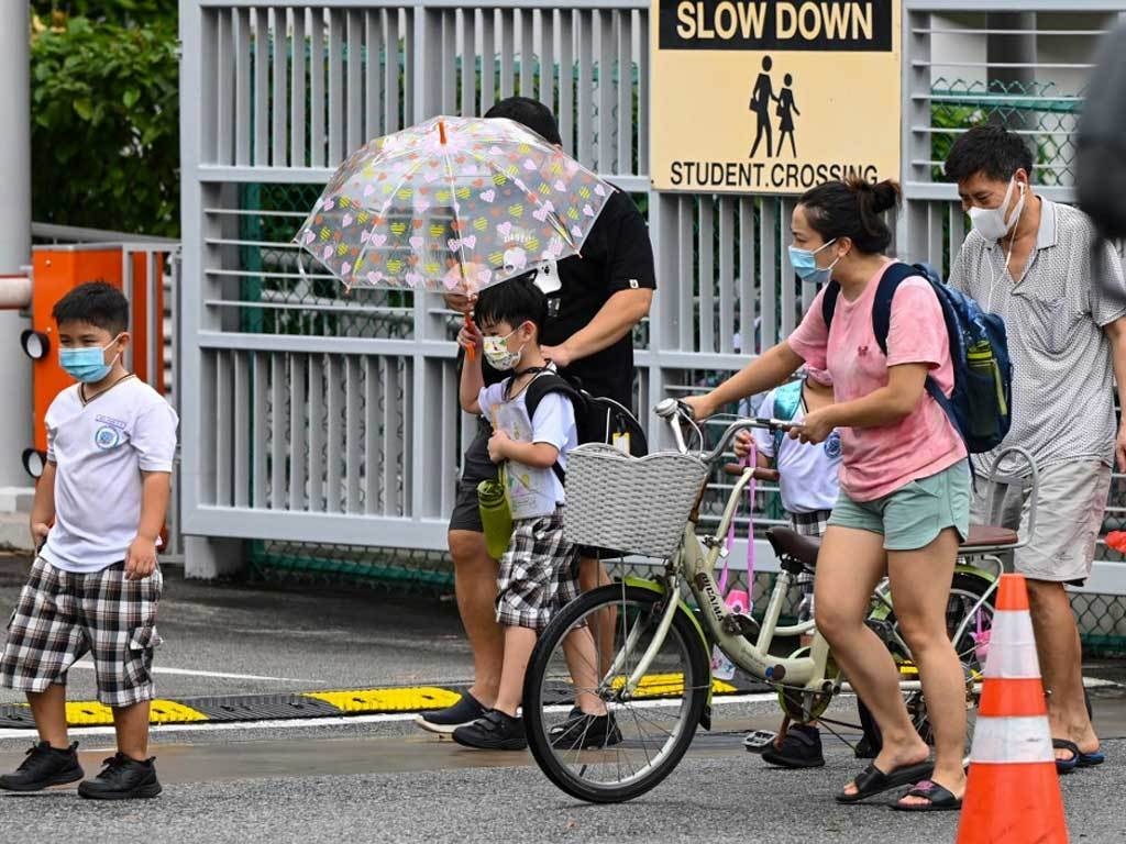 Singapore warns new virus strains infecting more children, shuts schools